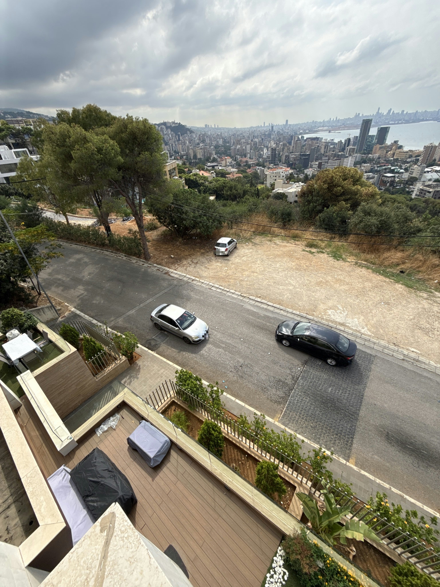 Dangerous curve puts at risk bldg residents exiting the parking (to the left of the picture)