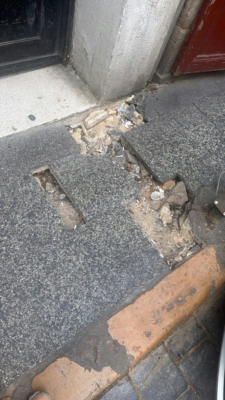 Broken sidewalk next to a neighbourhood coffee shop in Gemmayzeh